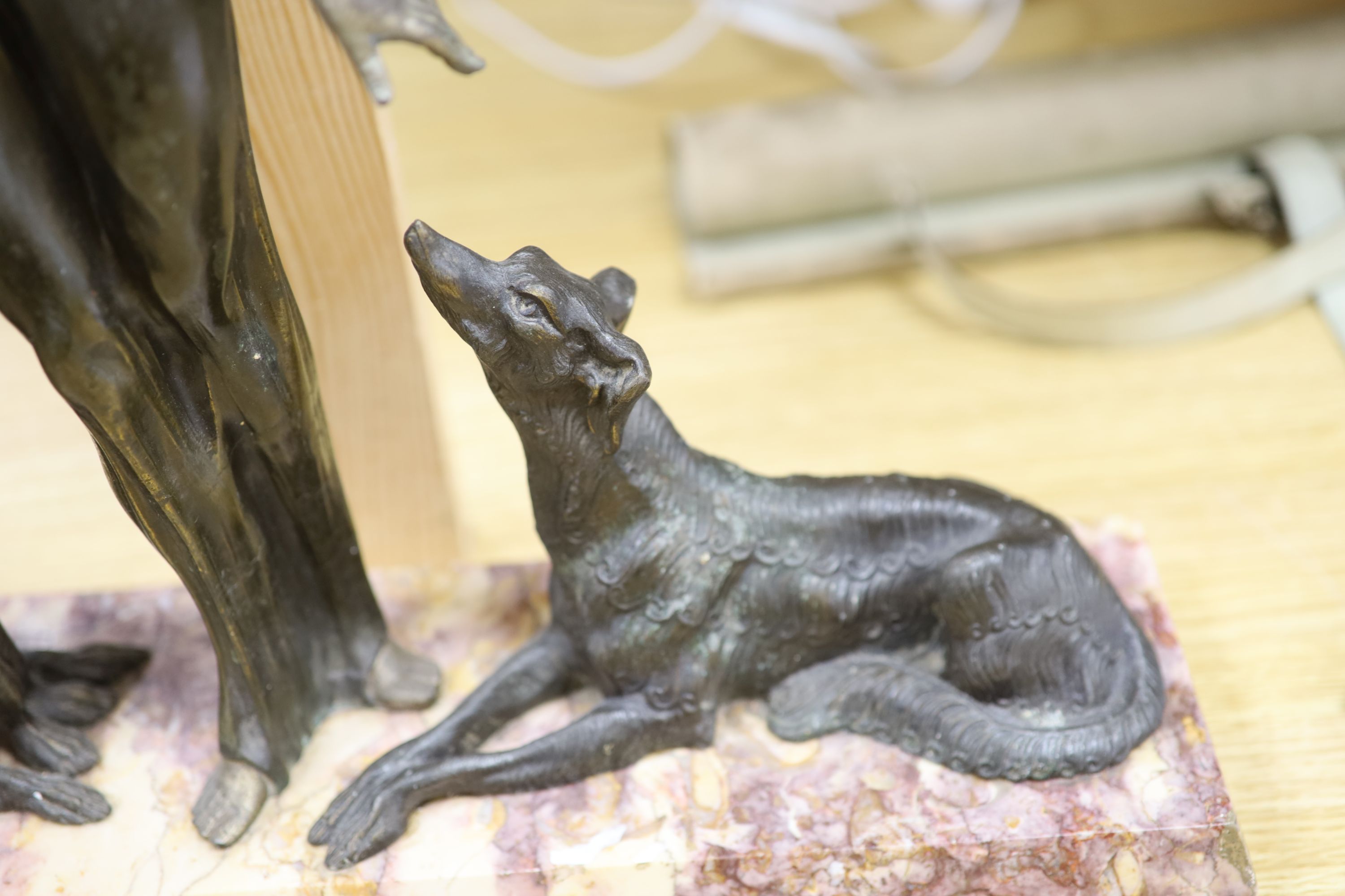 A Spelter Art Deco figure of a dog and borzoi, on a marble base, height 45cm